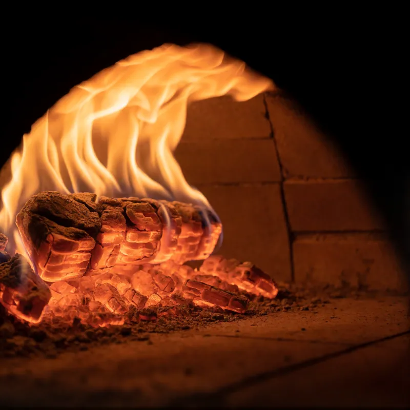 The fire in the coal-fired brick oven at Woodside Pizza, Woodside NY